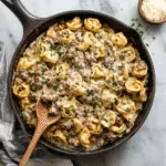 creamy one-skillet beef stroganoff tortellini in a cast iron skillet