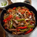 one pan pepper steak in a skillet with sauce